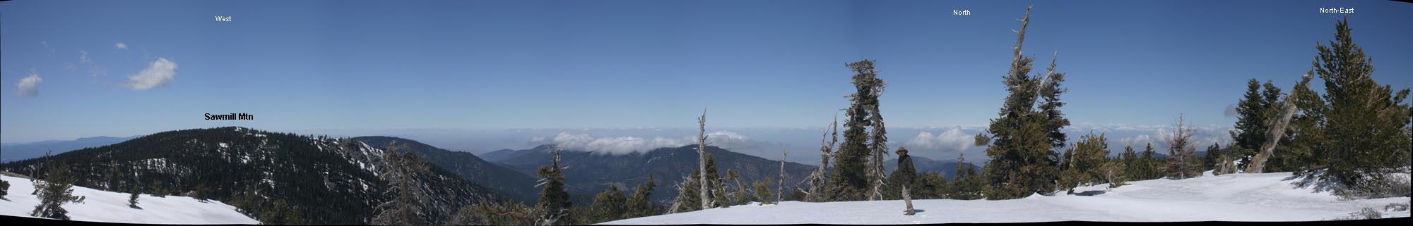 Panoramic view (roughly West to North-East) from Condor Lookout on the summit of Mt. Pinos. I am pictured between trees under North label