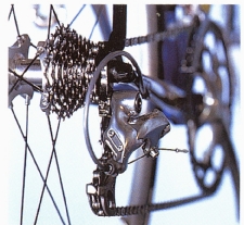 Shift the chain across until it is on the smallest cog and the largest chainring. 