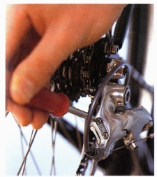 Use the high adjuster (usually marked “H”) to line up the jockey pulleys with the smallest cog. 