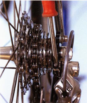 Prevent the jockey pulleys from making contact with the bigger cogs by screwing in the adjuster that butts onto the rear derailleur hanger on the frame dropout. Remember to make this adjustment if you fit a block or cassette with bigger cogs than usual.