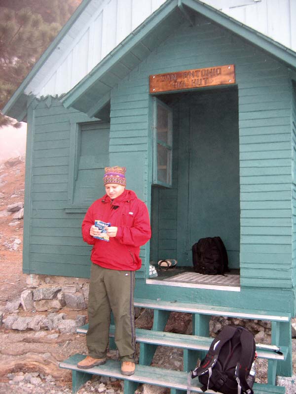 image: Dominick on the Zone diet, eating tuna. This image was taken at the San Antonio Ski Hut. The Hut, located at rougly 8200 feet, belongs to the Sierra Club and provides a convenient rest stop for hikers. It is also available to campers and lodgers for over-night stays