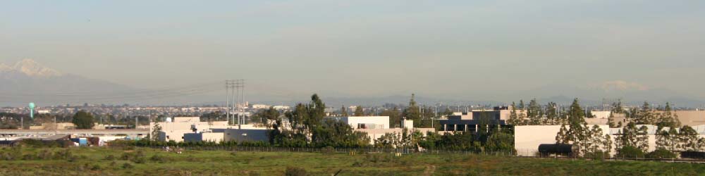 2005-01-16: View from the corner of Sepulveda and Rosecrans in Manhattan Beach, California. Visibility was excellent, allowing one to see Mount San Gorgonio (snow-covered mountain on the far right). The mountain on the far left is Cucamonga Peak, in western San Bernardino county