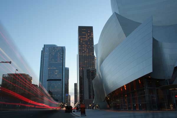 A single frame from a time-lapse movie that was captured March 7, 2006, from near the corner of 1st Street and Grand Ave (facing South). The Walt Disney Concert Hall (home of the Los Angeles Philharmonic) is the building structure immediately to the right. Well Fargo Center I (behind Concert Hall) and Deutsche Bank and Deloitte & Touche (left (East) side of Grand). Movie available on request. 