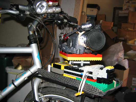 This image shows the Panobot 2 being used to rotate a miniDV camera, this one was also mounted to bike to achieve a certain visual effect. In other applications, it may also be used to pan a still camera for panoramic still photography or panned time-lapse cinematography.